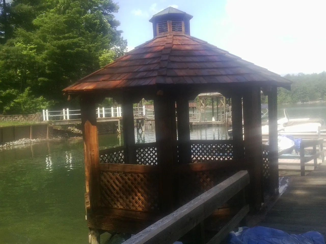 Cedar shake gazebo roof rebuilt on a lake dock in Franktown